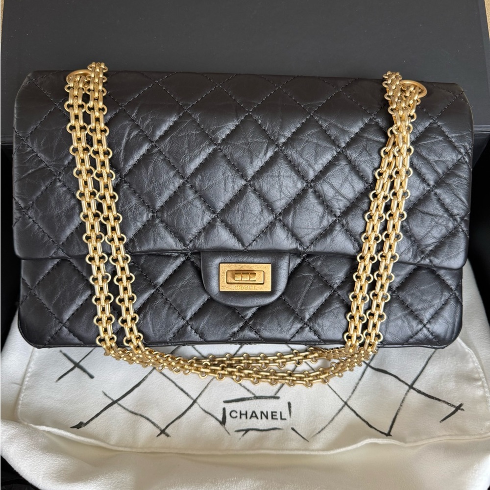 Chanel Black Quilted Leather Bag with Gold Chain—never carried.